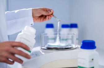 A person letting a white powder trickle into a petri dish, the other hand holding a flavour bottle.