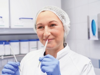 Flavourist at work, sniffing flavours.